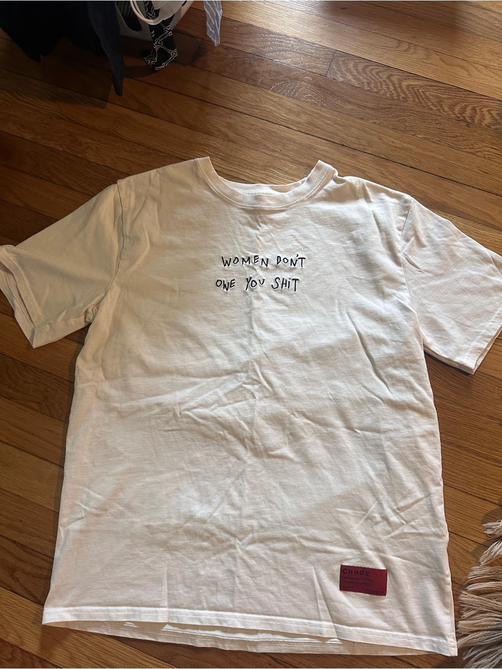 CHNGE 100 percent organic cotton size L “Women Don’t Owe You Shit”